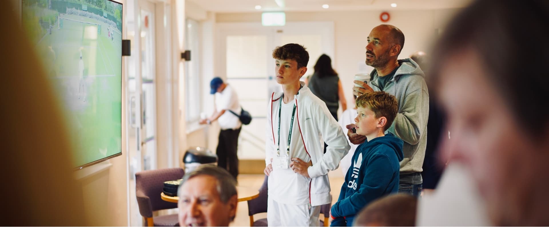 Tennis player watching tennis match