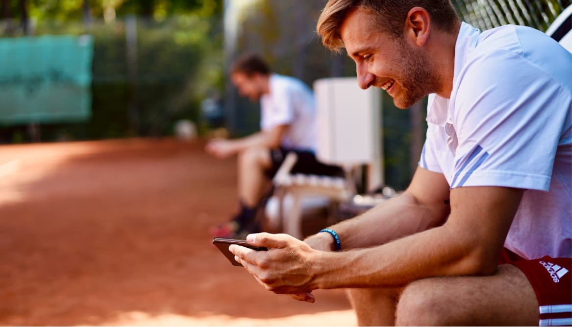 Tennis player with iPhone.